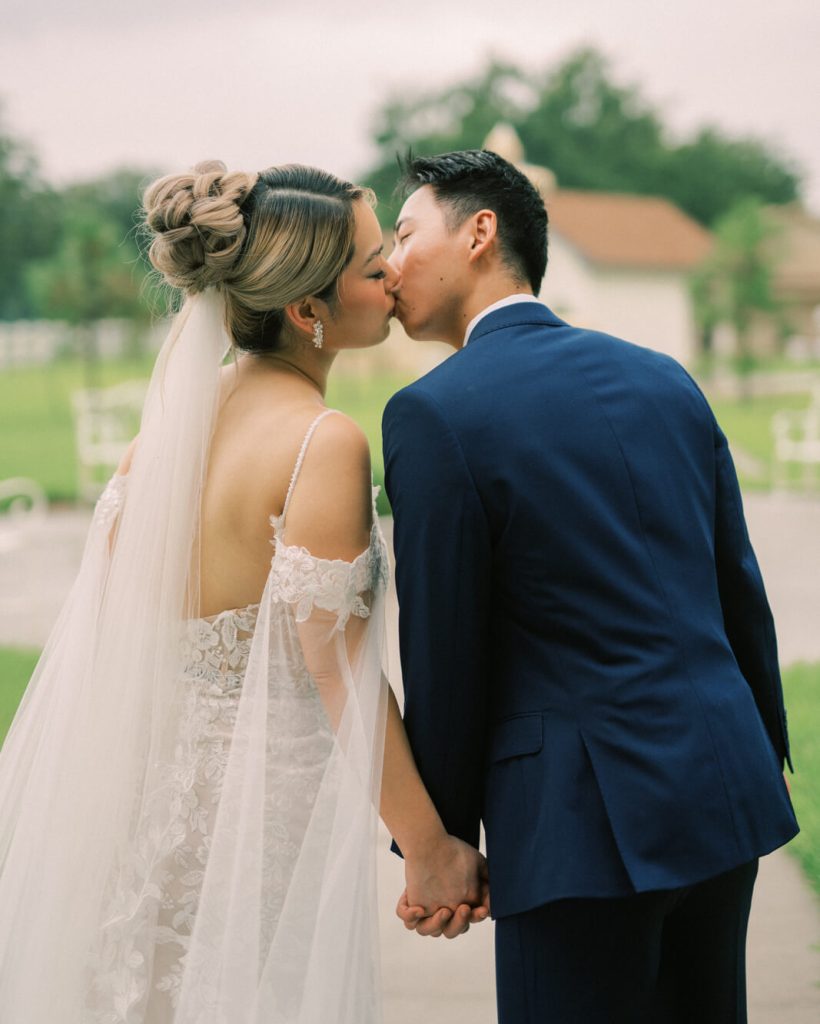 bride and groom kiss