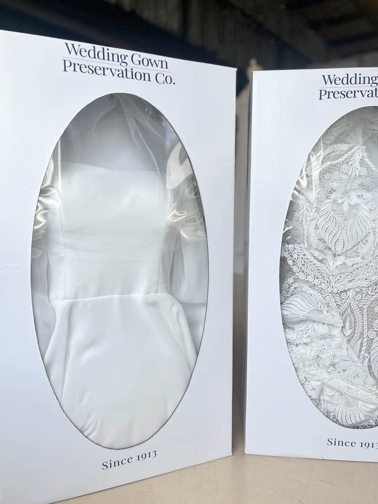 Preserved wedding dresses on boxes.