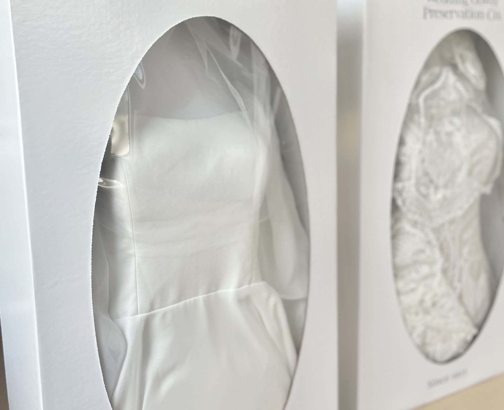 Preserved wedding dresses on boxes.