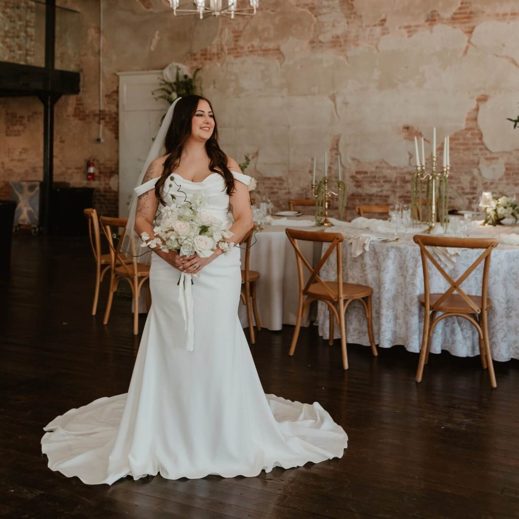 happy bride holding bouquet of flowers